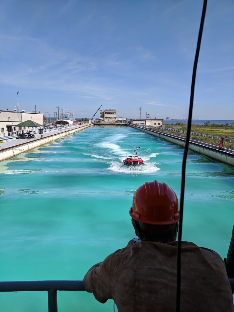 Testing amphibious vehicle in outdoor wave pool.